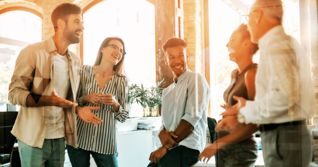 Teamwork in a modern office represents fulfillment through authenticity.