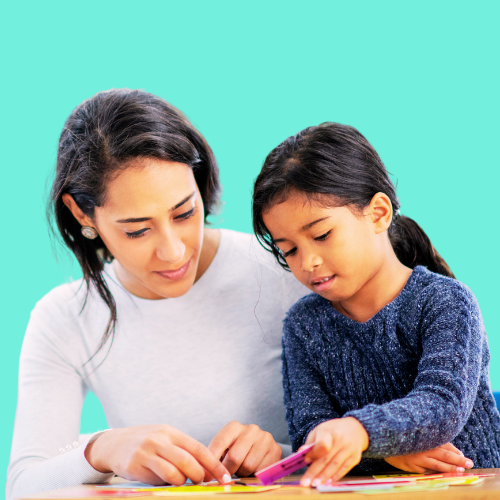 Mother and daughter have an authentic connection through playful, educational activity with colorful learning materials.