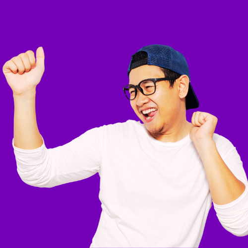 Young man celebrating joyfully with clenched fist against vibrant purple background.
